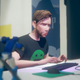 john sitting at his desk as jack in last stop